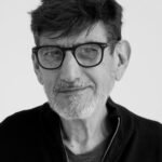 Aeris Method - the book Black and white portrait of an elderly man with glasses and facial hair, showcasing wisdom and serenity.